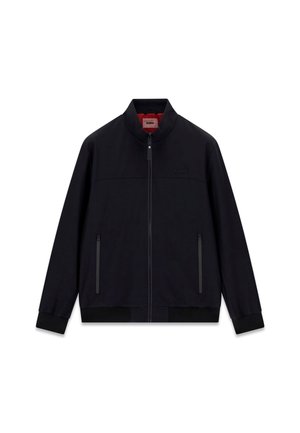 Črno jakno z zadrgo, stoječim ovratnikom, dvema sprednjima žepoma z zadrgo, privezki na manšetah in robu ter subtilno logotipom "GUESS" na prsih.