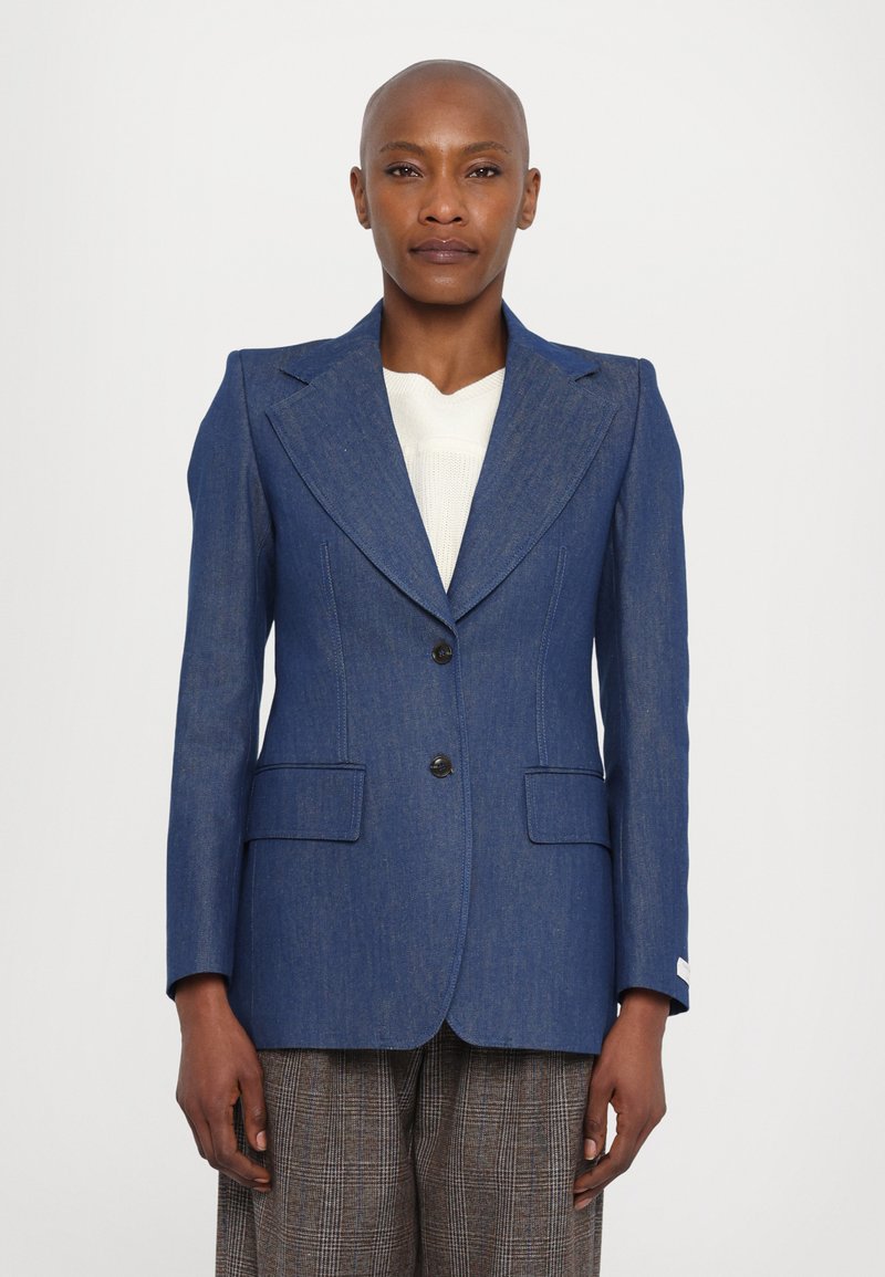 Blue denim blazer with a structured design, notched lapels, two front pockets, single button closure, and subtle texture.