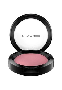 Compacto redondo negro con tapa transparente, que contiene rubor en polvo en un tono rosa mate. El compacto tiene una textura suave y un logotipo sencillo.