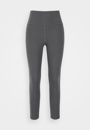Gray high-waisted leggings made of stretchy, smooth fabric with flat seams and a fitted design, suitable for active or casual wear.