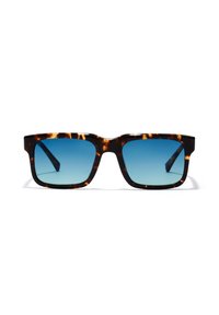 Schildpatt-Sonnenbrille mit quadratischen Rahmen und farbverlaufenden blauen Linsen. Verfügt über dicke Bügel für Haltbarkeit und eine glatte, polierte Oberfläche.