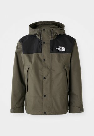 Green waterproof jacket with a black upper section, adjustable hood, snap buttons, and side pockets. Features logo on the chest.