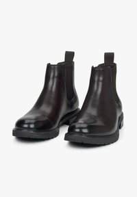 Czarne skórzane botki Chelsea z elastycznymi panelami bocznymi, gładkie wykończenie, okrągły czubek i niski gumowy obcas. Posiadają pętle ułatwiające zakładanie.