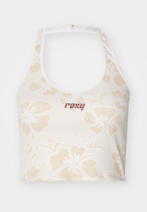 Blomsterprydd hvit crop top med beige hibiskusblomster og en brodert "Roxy" logo i mørkerød. Har en halskjede-design.