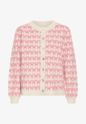 Gilet en tricot avec une base beige clair et des motifs de nœuds roses, col rond, devant à boutons, et poignets et ourlet côtelés.