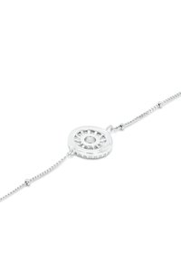 Silver bracelet featuring a round pendant with a textured design and a central circular cutout, secured with a delicate chain.