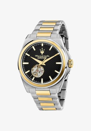 Automatik-Uhr mit schwarzem strukturiertem Zifferblatt, goldenen Akzenten, Gehäuse aus Edelstahl in Silberoptik und abwechselnden Gliedern aus Gold und Silber im Armband.