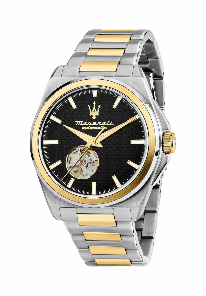 Orologio automatico con un quadrante nero texturizzato, dettagli dorati, cassa in acciaio inossidabile tono argento e maglie del bracciale alternate dorate e argento.