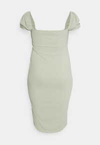 Vestido justo, verde claro, com mangas bufantes e decote quadrado. Feito de um tecido macio e elástico com discretos detalhes franzidos na lateral.