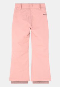 Pantaloni da neve impermeabili rosa con gambe svasate, passanti per cintura e polsini interni elastici, visti dal retro con un piccolo logo nero sul lato destro.