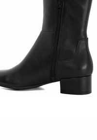 Black leather ankle boot featuring a side zipper, a rounded toe, and a low block heel, with smooth texture and minimal accents.