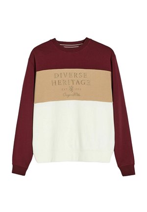 Bluza z blokami kolorów w odcieniach bordo, beżu i bieli. Teksturowana tkanina z haftowanym logo "Różnorodny Dziedzictwo". Okrągły dekolt, długie rękawy.