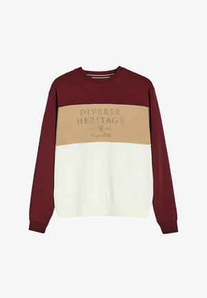 Bluza z blokami kolorów w odcieniach bordo, beżu i bieli. Teksturowana tkanina z haftowanym logo "Różnorodny Dziedzictwo". Okrągły dekolt, długie rękawy.