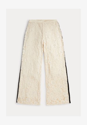 Široke hlače z nogavicami iz čipke v slonokoščeni barvi z teksturirano površino in črnimi stranskimi črtami. Elastičen pas za udobje in prileganje.