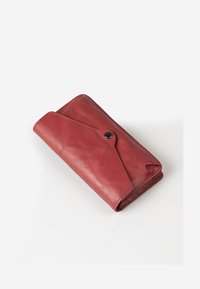 Red leather wallet featuring a folded design, a snap closure, and smooth texture, with a subtle sheen and stitching details.