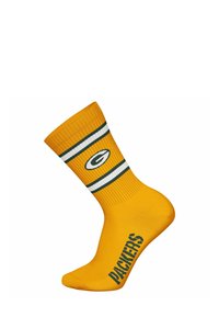 Calcetín de algodón amarillo con textura acanalada, que presenta un puño a rayas verdes y blancas y "PACKERS" impreso en letras verdes en negrita.