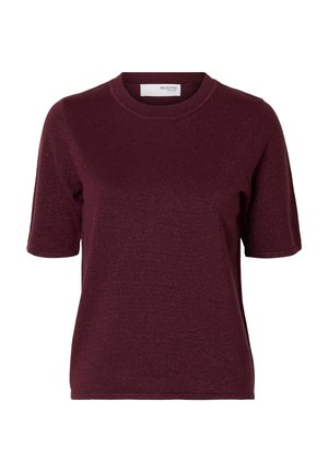 Burgundy short-sleeve knit top with a round neckline. Soft texture with a subtle sheen. Tag at the back showcases brand name.