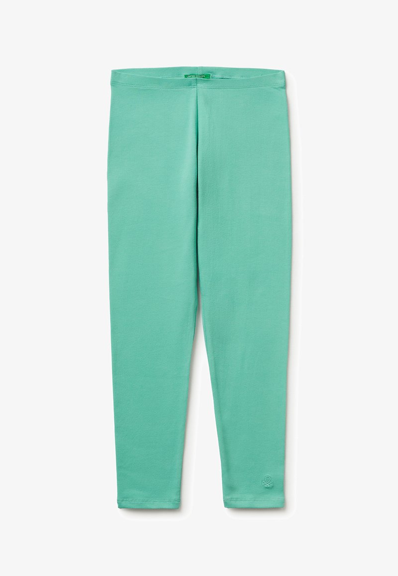 Leggings en tissu doux vert menthe avec une taille cintrée et un petit logo près de la cheville gauche.