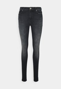 Jeans ajustados en denim de lavado oscuro con un ligero desvanecimiento, bolsillos delanteros y traseros, cierre de botón metálico y sin detalles de desgaste visibles.
