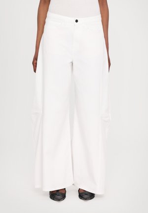 Wide-leg white denim pants with a high waist, featuring front pockets and a black button. Smooth texture with loose, flowing shape.