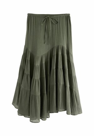 Jupe verte à volants avec une taille élastique et un détail de lien, présentant un tissu texturé et plusieurs couches de volants.