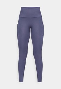 High-waisted, seamless navy blue athletic leggings with side pockets and subtle textured pattern, designed for activewear.