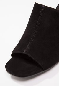 Vagabond Mules à talons - black