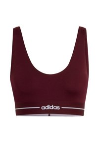Maroon sports bra with wide shoulder straps, textured fabric, and a white Adidas logo on the elastic band. Smooth, fitted design.