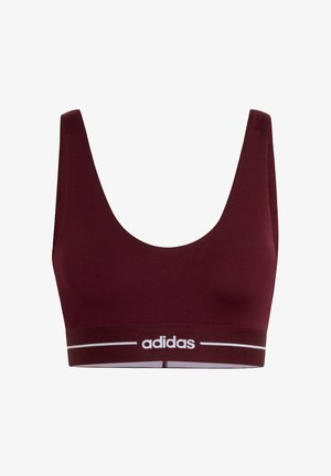 Soutien-gorge de sport bordeaux avec de larges bretelles, tissu texturé, et un logo Adidas blanc sur la bande élastique. Design lisse et ajusté.