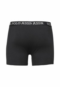 Svarta boxershorts med mjuk, elastisk midjeresår som har vit "U.S. POLO ASSN."-logotyp. Mjuk textur, figursydd design utan mönster.