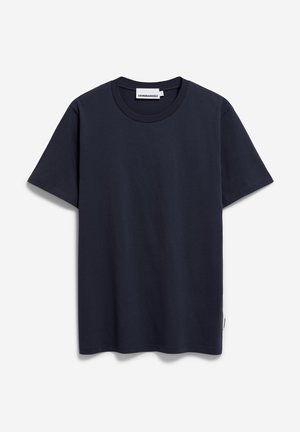 Marineblaue Baumwoll-T-Shirt mit Rundhalsausschnitt, kurzen Ärmeln und geradem Saum. Verfügt über ein dezentes Markenetikett an der Seitennaht.