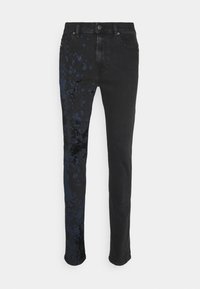 Black jeans with a straight-leg design, featuring blue splatter patterns on one side. Made of denim fabric with a smooth texture.