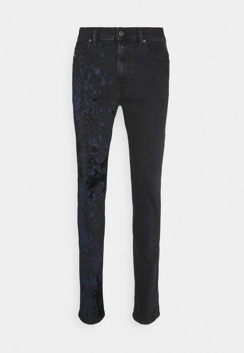 Black jeans with a straight-leg design, featuring blue splatter patterns on one side. Made of denim fabric with a smooth texture.