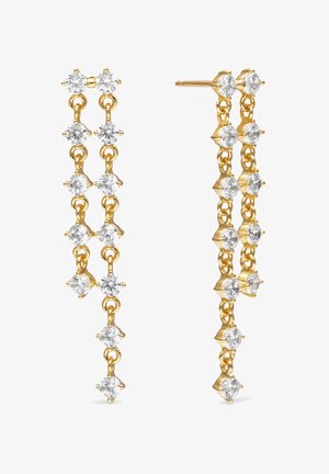 Zlaté náušnice visiace na dvoch paralelných retiazkach, z ktorých každá má päť okrúhlych čistých drahokamov spojených vertikálne.