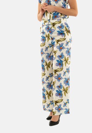 Pantaloni a vita alta in tessuto a motivi floreali con fiori blu e arancioni su uno sfondo crema. Presentano gamba larga e chiusura con zip.