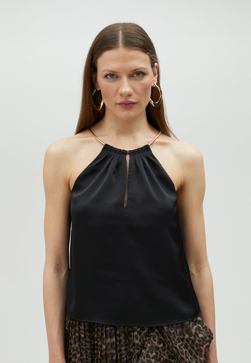 Black satin halter top featuring a keyhole detail at the front and a gathered neckline. Smooth texture with a subtle sheen.