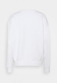 Sweat-shirt blanc uni à manches longues avec poignets et ourlet côtelés, montré de dos sur fond blanc.