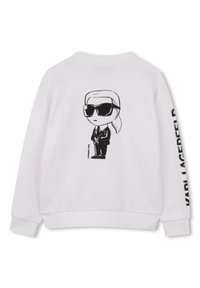 Λευκό φούτερ με μαύρη καρικατούρα ενός φιγουράτου προσώπου με γυαλιά ηλίου στην πλάτη και εκτυπωμένο κείμενο στο μανίκι.