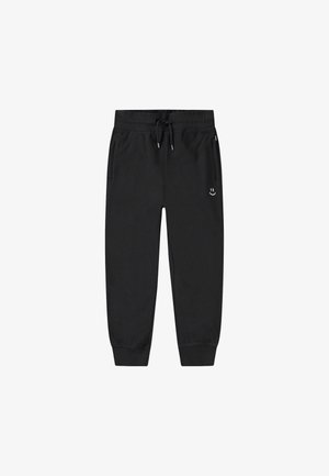 Sorte joggingbukser med snoretræk i taljen, tapered ben, sidelommer og et lille hvidt smilende ansigt logo på venstre lår.
