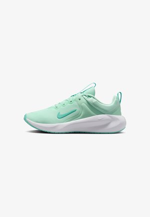 Chaussure de course Nike vert clair avec semelle blanche épaisse, design à lacets et petit swoosh Nike sur le côté et la semelle.