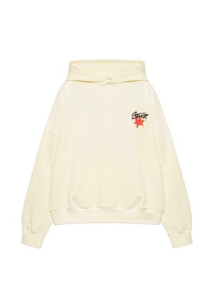 Kremowa bluza z kapturem z przednią kieszenią, małym czerwonym kwiatem i czarnym stylizowanym napisem na górnej lewej części klatki piersiowej.