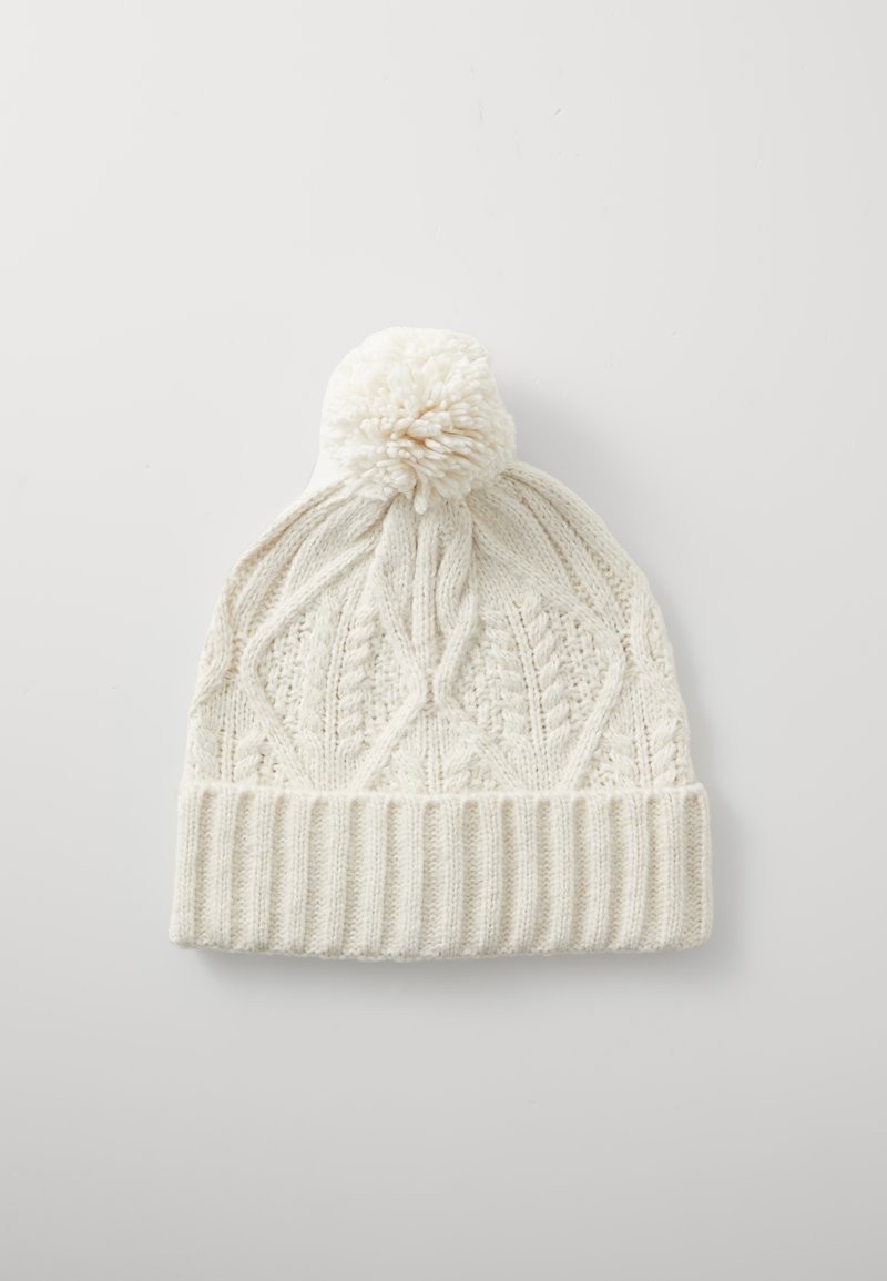 Berretto lavorato a maglia color crema con un motivo testurizzato, dotato di un orlo a coste e di un pompon sulla parte superiore. Materiale morbido con una vestibilità confortevole.