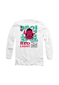 White long-sleeve shirt featuring a cartoon character with pigtails, bold text, and colorful prints in pink and green.