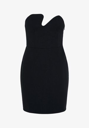 Mini abito nero senza spalline con scollo a cuore e silhouette aderente su sfondo chiaro uniforme.