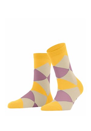 Gelbe und cremefarbene Socken mit geometrischen lila und gelben Mustern, versehen mit einer einfarbigen gelben Zehen- und Bündchenpartie, aus einem glatten, dehnbaren Material gefertigt.