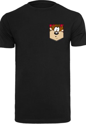 Black cotton t-shirt featuring a cartoon character graphic in a pocket design on the left chest, with brown and beige tones and contrasting accents.