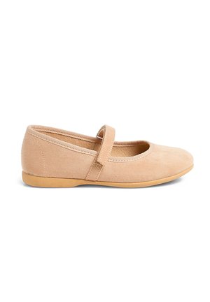 Light beige suede Mary Jane flats with a round toe, flat rubber sole, and adjustable strap across the instep. Soft, smooth texture.