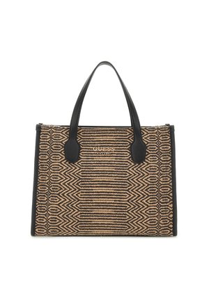 Prostokątna torba Guess typu tote z czarnym geometrycznym, tkanym wzorem, czarnymi skórzanymi uchwytami i napisem logo "GUESS EST 1981" z przodu.