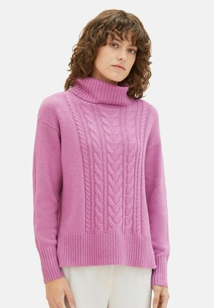 Pink knitted sweater featuring a high turtleneck, cable knit design, ribbed hem and cuffs, and a loose fit. Soft texture.