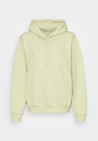 Ljusgrön hoodie med dragsko, framficka, ribbade cuffs och nederkant. Mjuk textur och avslappnad passform. Inga synliga mönster.